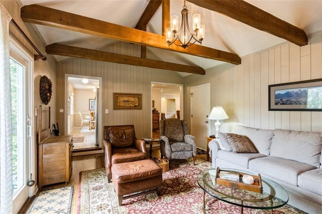 9613 Dearborn St, Overland Park, KS 66207 - living room featuring a chandelier, wood walls, and wood finished floors