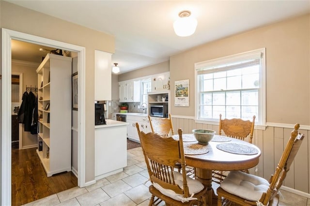 9613 Dearborn St, Overland Park, KS 66207 - dining area featuring a wainscoted wall