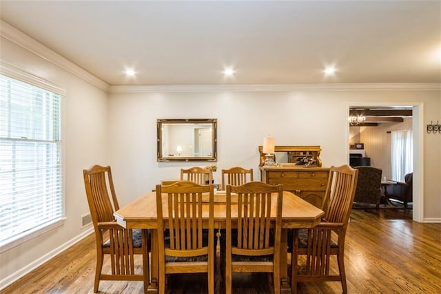 9613 Dearborn St, Overland Park, KS 66207 - dining room with wood finished floors, crown molding, and baseboards