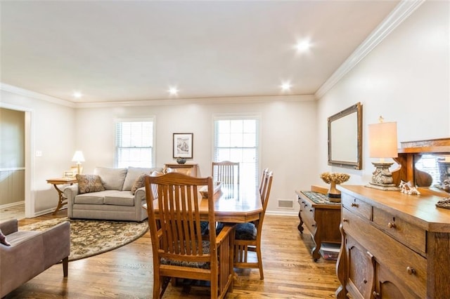 9613 Dearborn St, Overland Park, KS 66207 - dining room featuring wood finished floors, crown molding, baseboards, and recessed lighting
