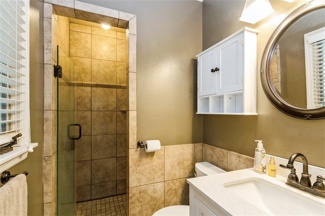 9613 Dearborn St, Overland Park, KS 66207 - full bathroom with toilet, vanity, a stall shower, and tile walls