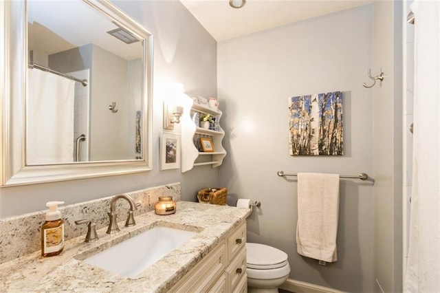 9613 Dearborn St, Overland Park, KS 66207 - bathroom with vanity, toilet, and curtained shower