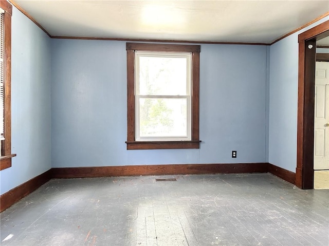 206 S Main St, Trenton, MO 64683 - spare room featuring ornamental molding and baseboards
