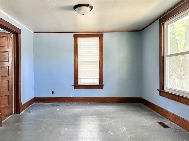 206 S Main St, Trenton, MO 64683 - spare room with crown molding and baseboards