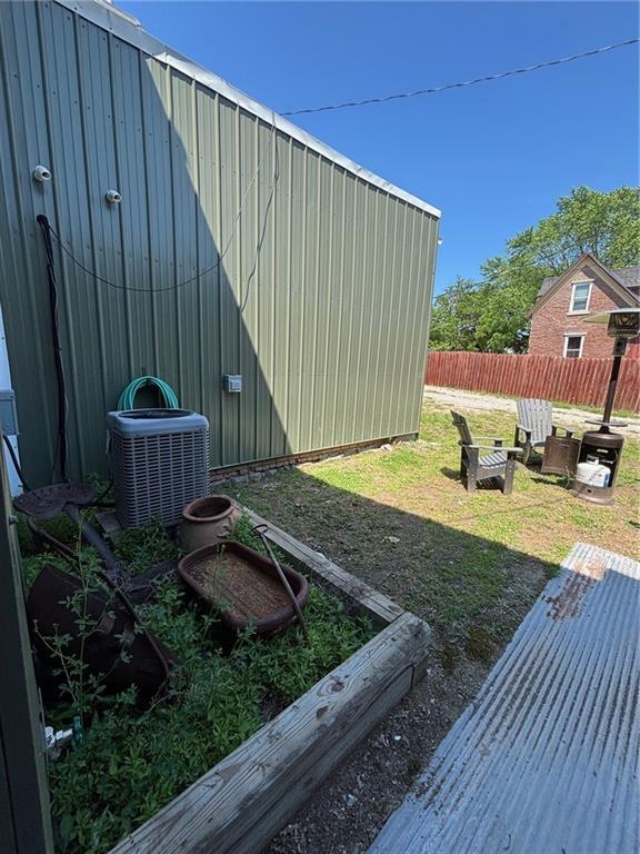 115 N 3rd St, Burlington, KS 66839 - view of yard featuring central air condition unit