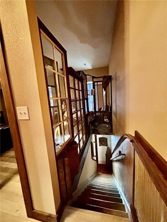 115 N 3rd St, Burlington, KS 66839 - staircase featuring wood finished floors and a textured wall