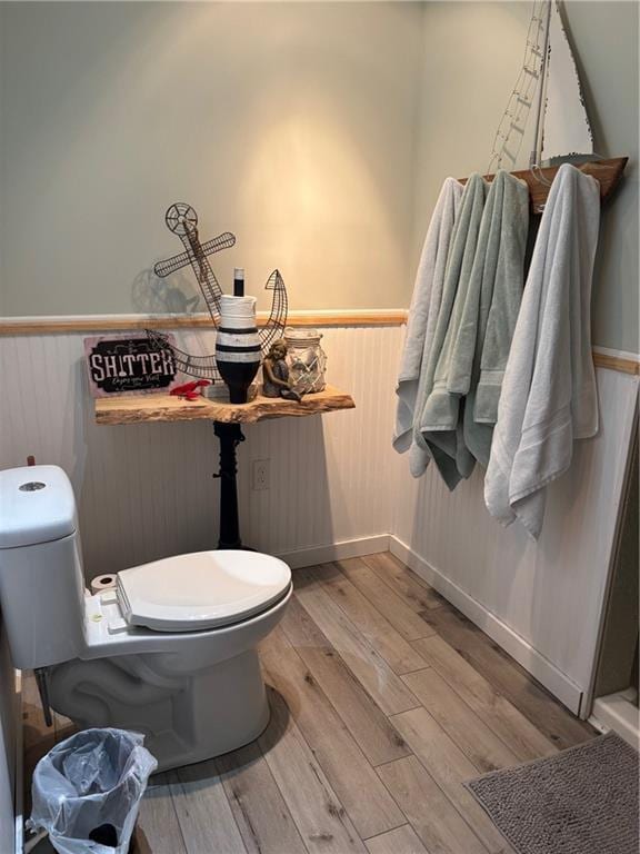 115 N 3rd St, Burlington, KS 66839 - bathroom with toilet, a wainscoted wall, wood finished floors, and baseboards