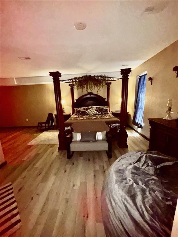 115 N 3rd St, Burlington, KS 66839 - bedroom featuring wood finished floors