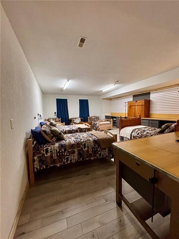 115 N 3rd St, Burlington, KS 66839 - bedroom with light wood finished floors and a textured wall
