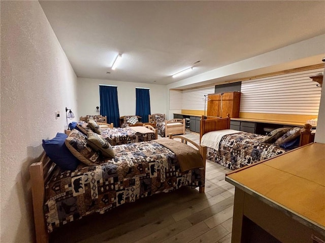 115 N 3rd St, Burlington, KS 66839 - bedroom featuring dark wood-style floors and a textured wall