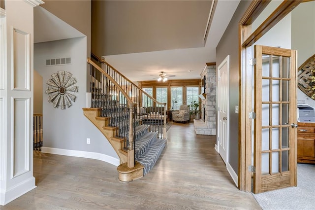 5204 W 166th St, Overland Park, KS 66085 - foyer featuring wood finished floors, baseboards, ceiling fan, and stairs