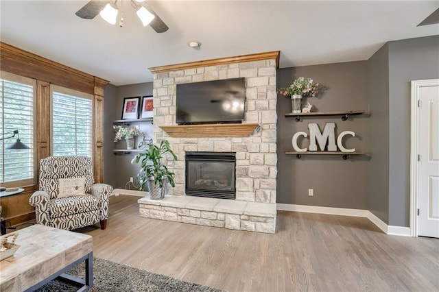 5204 W 166th St, Overland Park, KS 66085 - living room featuring a ceiling fan, wood finished floors, and baseboards