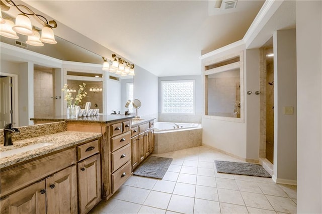 5204 W 166th St, Overland Park, KS 66085 - full bath featuring tile patterned flooring, a bath, vanity, a tile shower, and vaulted ceiling