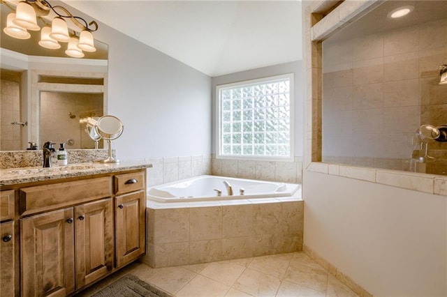 5204 W 166th St, Overland Park, KS 66085 - bathroom with a bath, tile patterned flooring, vanity, a tile shower, and vaulted ceiling