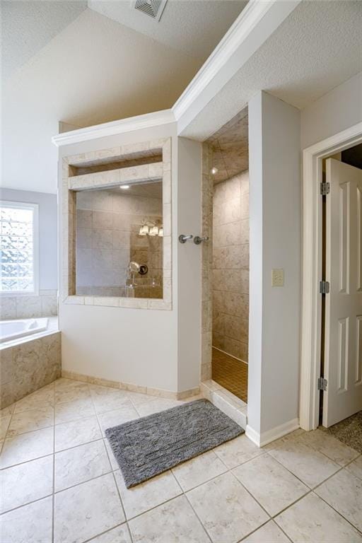 5204 W 166th St, Overland Park, KS 66085 - bathroom featuring a bath, tiled shower, and tile patterned flooring