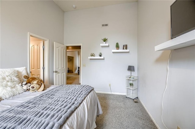 5204 W 166th St, Overland Park, KS 66085 - bedroom featuring carpet flooring, a towering ceiling, and baseboards