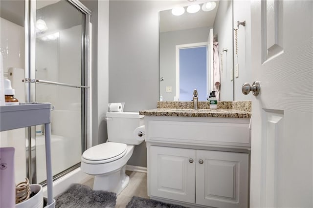 5204 W 166th St, Overland Park, KS 66085 - full bathroom with toilet, vanity, a shower with door, and tile patterned flooring