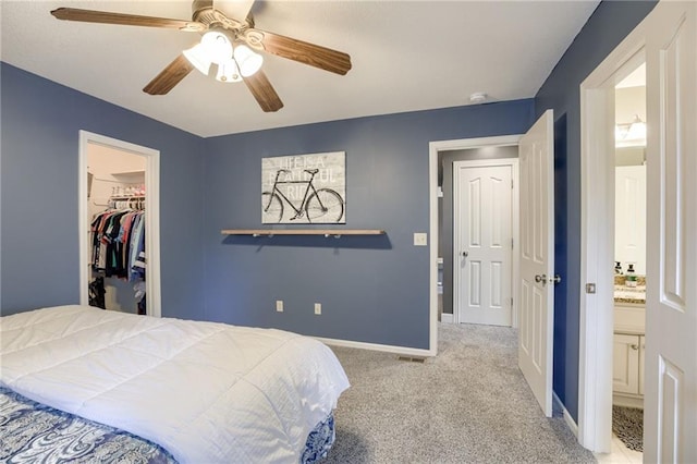 5204 W 166th St, Overland Park, KS 66085 - carpeted bedroom featuring a spacious closet, baseboards, a closet, and ceiling fan