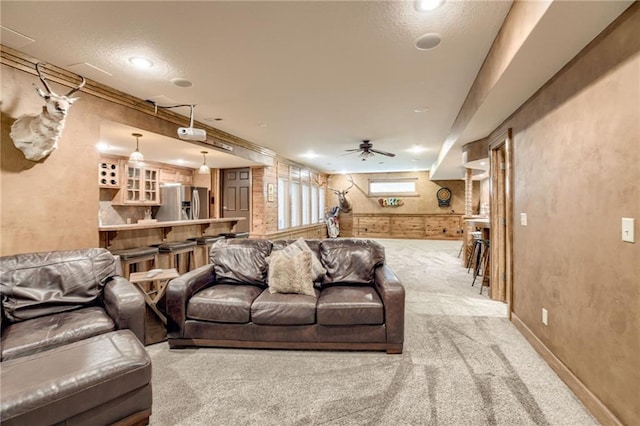 5204 W 166th St, Overland Park, KS 66085 - living area with light colored carpet, a ceiling fan, baseboards, recessed lighting, and a textured ceiling