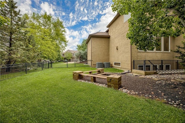 5204 W 166th St, Overland Park, KS 66085 - view of yard featuring central AC and a garden