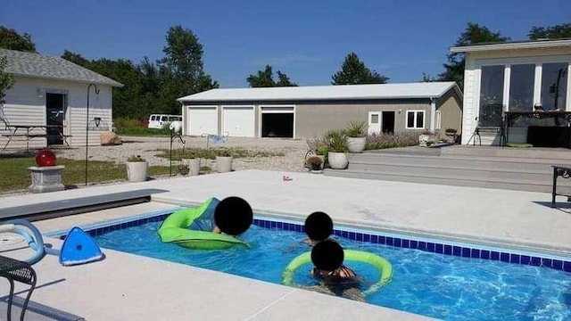 17795 K Hwy, Saint Joseph, MO 64505 - back of property featuring an outdoor pool, a patio, and a wooden deck
