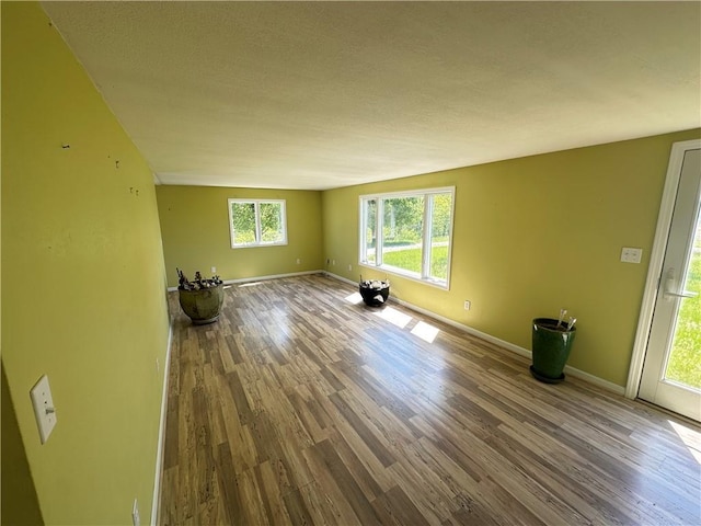 17795 K Hwy, Saint Joseph, MO 64505 - unfurnished living room with wood finished floors and baseboards