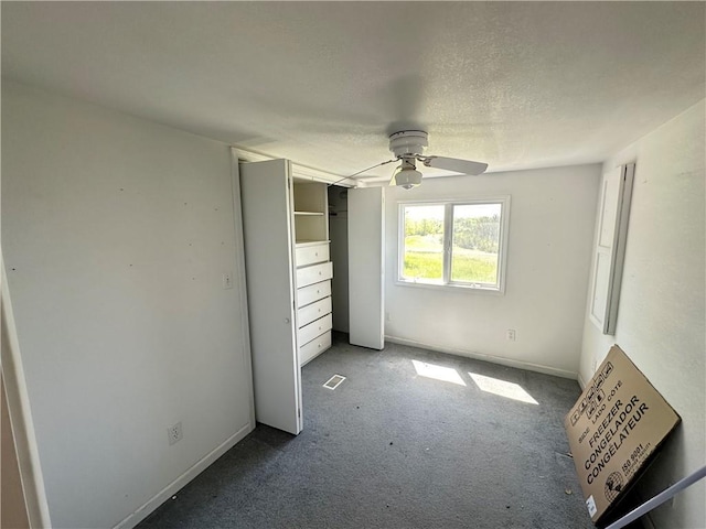 17795 K Hwy, Saint Joseph, MO 64505 - unfurnished bedroom featuring carpet, ceiling fan, a closet, and a textured ceiling