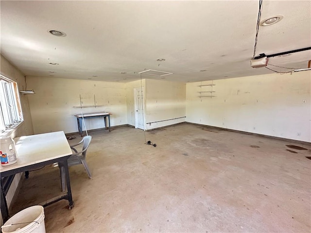 17795 K Hwy, Saint Joseph, MO 64505 - garage featuring a garage door opener and baseboards