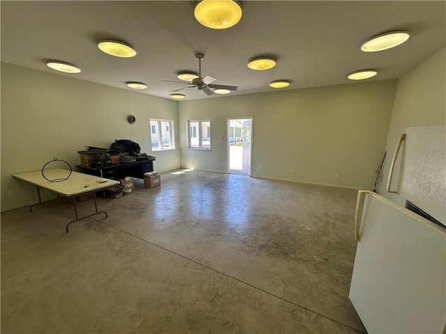17795 K Hwy, Saint Joseph, MO 64505 - living area featuring finished concrete floors, ceiling fan, and baseboards