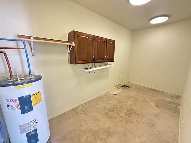 17795 K Hwy, Saint Joseph, MO 64505 - laundry area with electric water heater, cabinet space, and baseboards