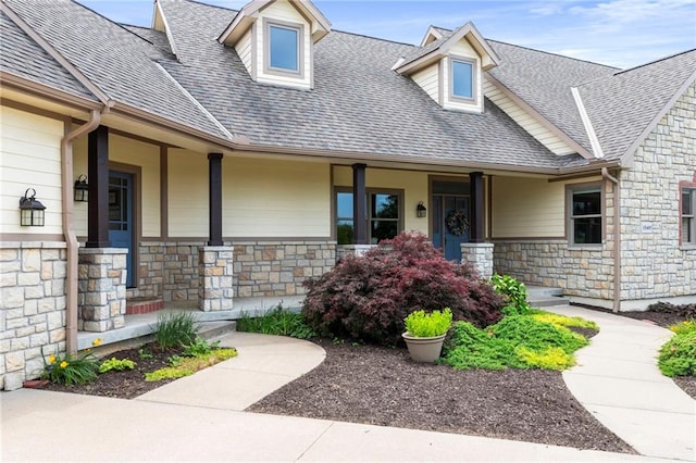 15405 161st St, Bonner Springs, KS 66012 - view of front of house with covered porch, stone siding, and a shingled roof