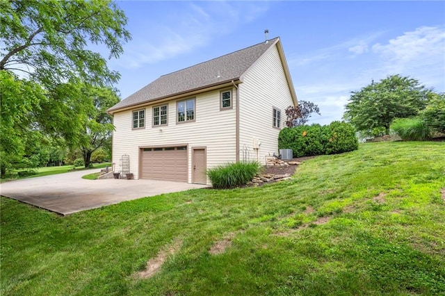 15405 161st St, Bonner Springs, KS 66012 - view of property exterior featuring concrete driveway, an attached garage, and a yard