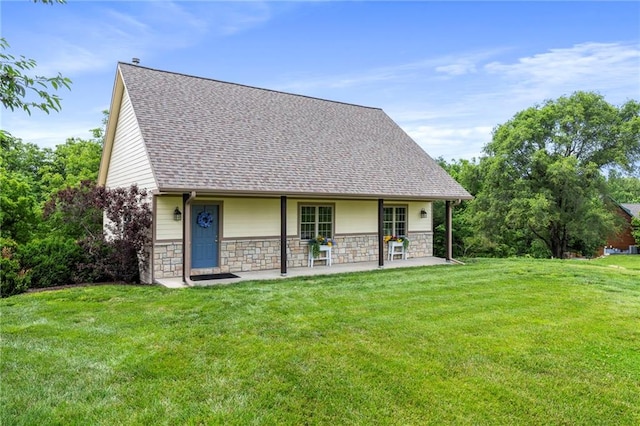 15405 161st St, Bonner Springs, KS 66012 - back of house with stone siding, a lawn, and a shingled roof