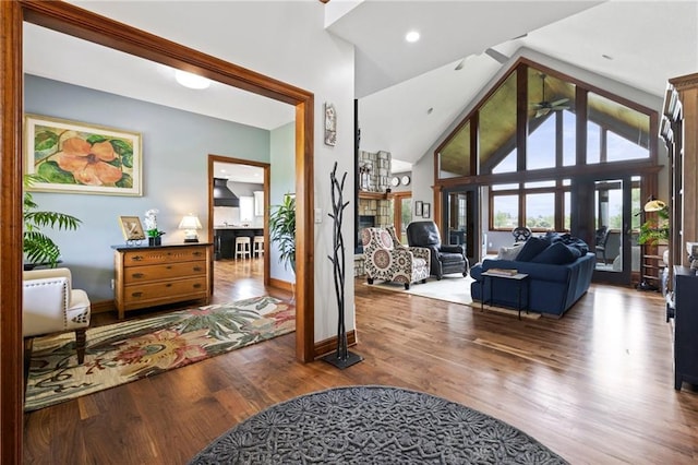 15405 161st St, Bonner Springs, KS 66012 - foyer featuring a stone fireplace, wood finished floors, ceiling fan, and high vaulted ceiling