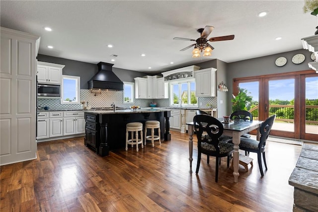 15405 161st St, Bonner Springs, KS 66012 - dining space featuring dark wood-type flooring, a ceiling fan, and recessed lighting