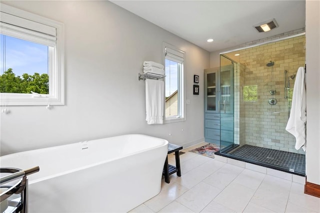 15405 161st St, Bonner Springs, KS 66012 - bathroom featuring a stall shower, a soaking tub, recessed lighting, and tile patterned flooring
