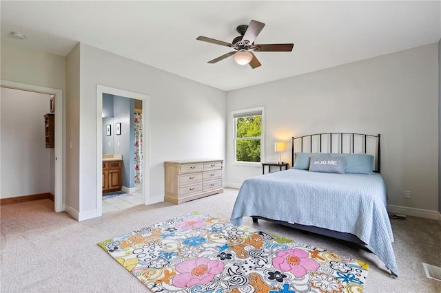 15405 161st St, Bonner Springs, KS 66012 - bedroom with light colored carpet, connected bathroom, and ceiling fan