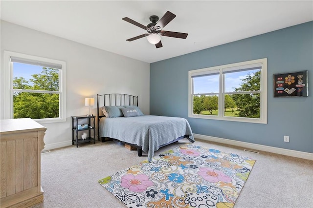 15405 161st St, Bonner Springs, KS 66012 - bedroom featuring light carpet, multiple windows, and a ceiling fan