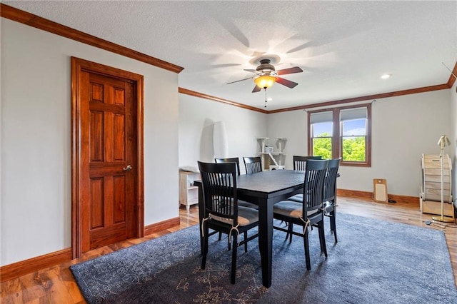 15405 161st St, Bonner Springs, KS 66012 - dining area with crown molding, ceiling fan, wood finished floors, and recessed lighting