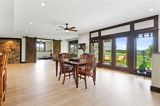 15405 161st St, Bonner Springs, KS 66012 - dining room featuring a barn door, light wood-type flooring, recessed lighting, and a ceiling fan