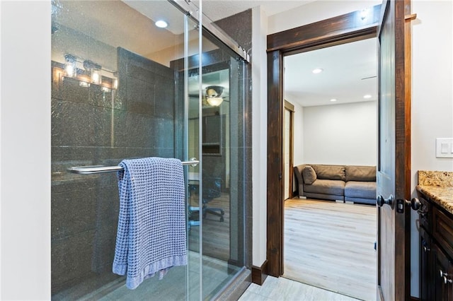 15405 161st St, Bonner Springs, KS 66012 - full bath featuring vanity, a stall shower, and recessed lighting