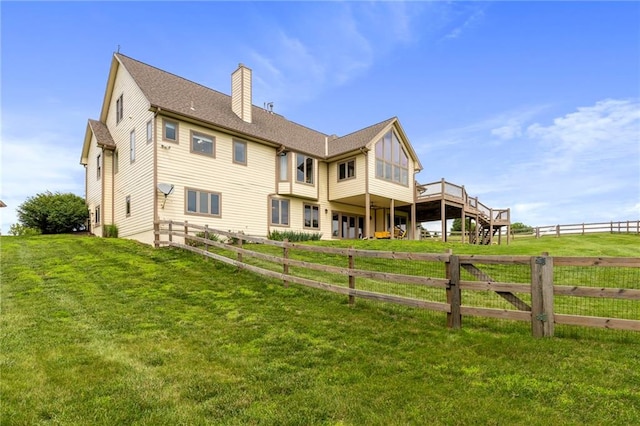 15405 161st St, Bonner Springs, KS 66012 - back of property with a chimney and a wooden deck