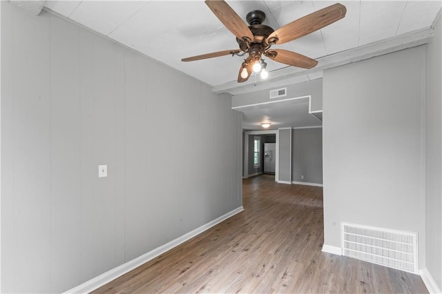 115 Brown Ave, Osawatomie, KS 66064 - unfurnished room featuring wood finished floors, ceiling fan, and baseboards
