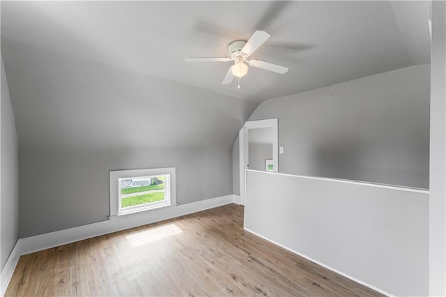 115 Brown Ave, Osawatomie, KS 66064 - additional living space with lofted ceiling, wood finished floors, and ceiling fan