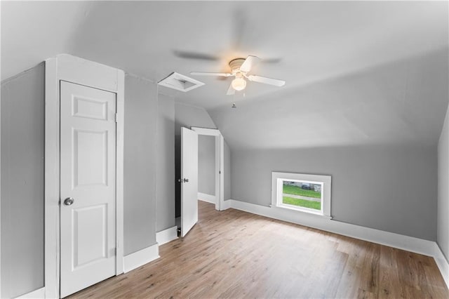 115 Brown Ave, Osawatomie, KS 66064 - additional living space featuring vaulted ceiling, wood finished floors, baseboards, attic access, and ceiling fan