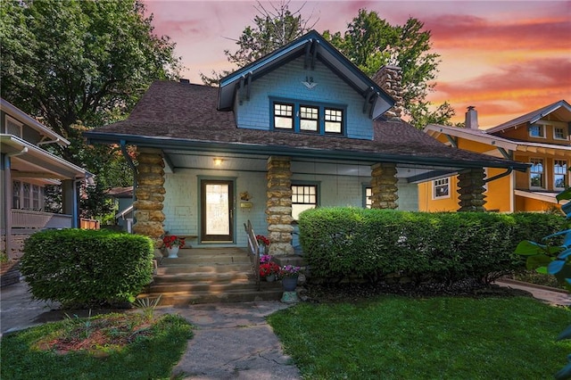 12 W 57th Ter, Kansas City, MO 64113 - view of front facade with covered porch and a chimney