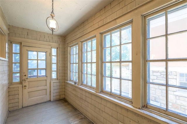 12 W 57th Ter, Kansas City, MO 64113 - doorway to outside featuring light wood-style floors
