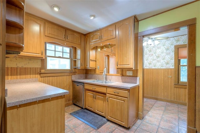 12 W 57th Ter, Kansas City, MO 64113 - kitchen featuring stainless steel dishwasher, wainscoting, light countertops, open shelves, and wooden walls