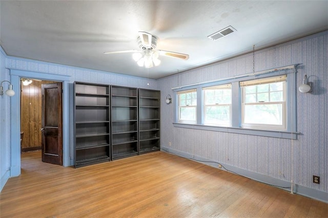 12 W 57th Ter, Kansas City, MO 64113 - spare room featuring wood finished floors and ceiling fan
