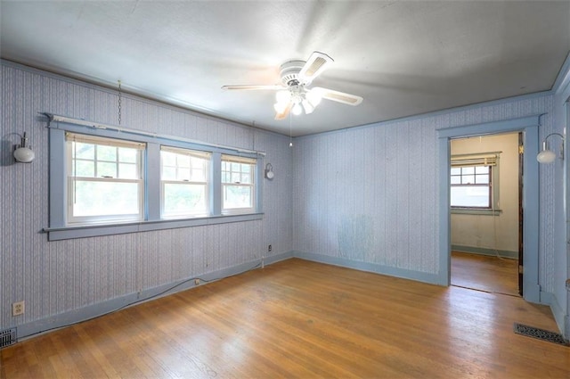12 W 57th Ter, Kansas City, MO 64113 - unfurnished room featuring hardwood / wood-style floors and a ceiling fan